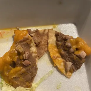 two pieces of food in a styrofoam container