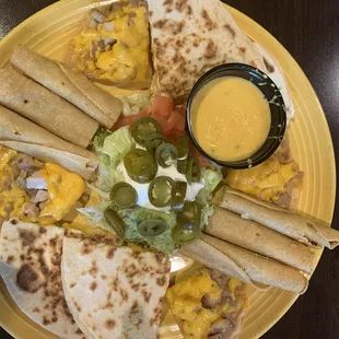 a plate of quesadillas and salsa