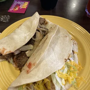 Beef fajita with grilled onions &amp; beef picadillo with lettuce, tomato &amp; cheese