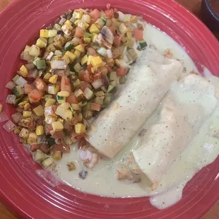 Shrimp enchiladas, veggies substituted for beans and rice