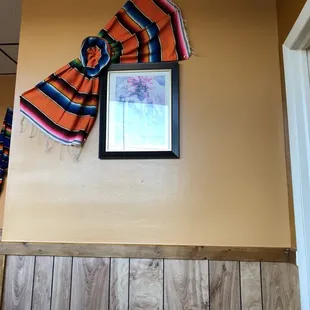 a scarf hanging on a wall