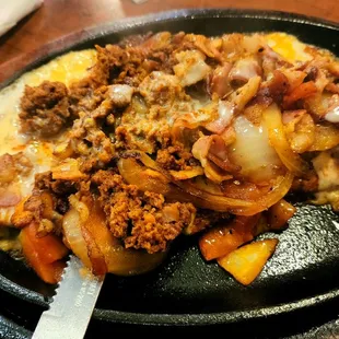 Pollo Super Charro: grilled chicken breast, bacon, chorizo, grilled onions topped with nacho cheese