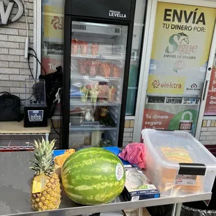 a watermelon and a pineapple on a table