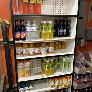 a grocery store shelf filled with drinks