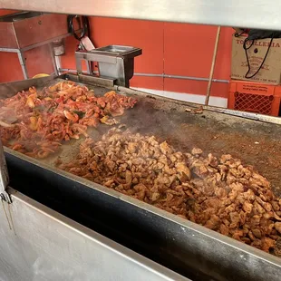 chicken being cooked in a commercial kitchen