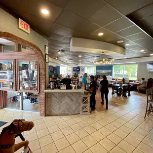 Spacious, open and bright dining area.  Outdoor seating appears to be available.