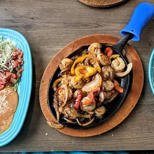 These are their Shrimp Fajitas entrée.  Photo taken June 6, 2023.