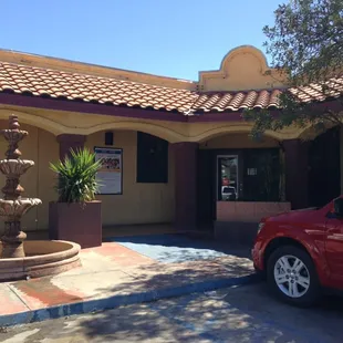 a fountain in front of a building