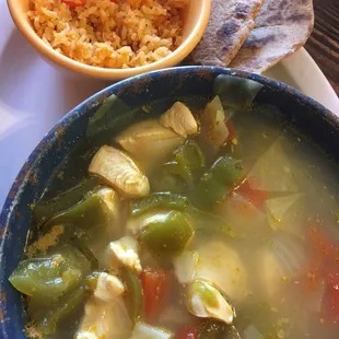 Large bowl of chicken soup, rice &amp; wheat tortillas.
