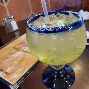 a margarita in a glass with a straw