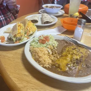 Menudo, homemade tortillas, carne guisada tacos, puffy beef tacos, beef enchilada, beef tamale, beans and rice.
