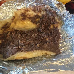 Lots of barbacoa, it is greasy but still pretty good.
