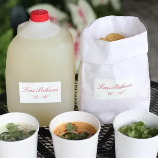 four cups of soup and a jug of soup