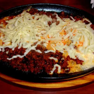 Delicious queso fundido served a la plancha