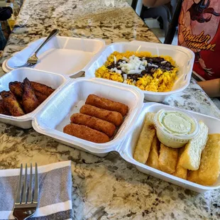Black beans with rice, plantains, Yuka fries, and cheese croquettes