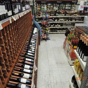 rows of wine bottles in a store