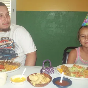 big bro lookin over lil sis (delilah) on her special day. ENOUGH W/ DA PICS !! CAN WE JUST EAT ?