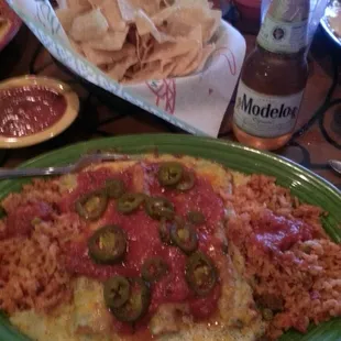 3 beef enchiladas smothered in green tomatillo sauce and cheese with Modelo Especial...