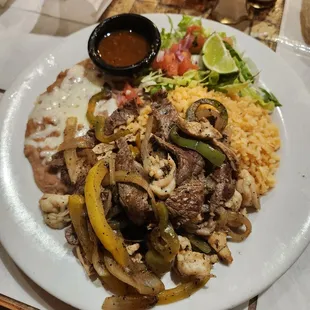 Steak, chicken, and shrimp platter.