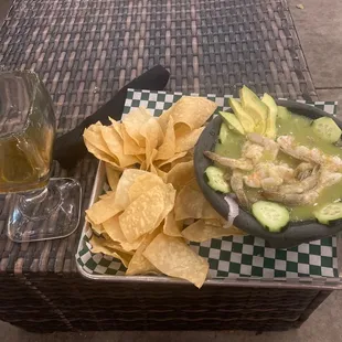 a plate of chips and a bowl of guacamole