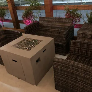 Cozy sitting area by the fireplace on the patio