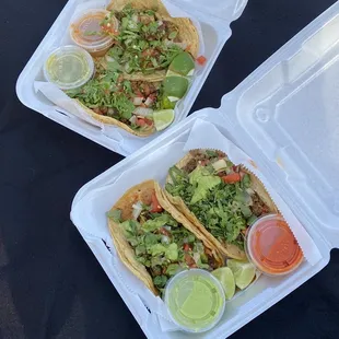 two take out containers of food