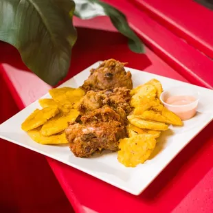 Hand battered chicken with fried green plantains. Order our &quot;Chicharron de Pollo con Tostones&quot; with our signature mayo-ketchup sauce