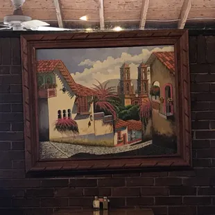 a painting on a brick wall