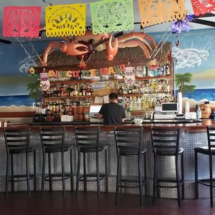 a woman sitting at a bar