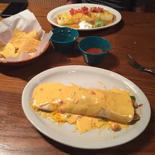 Las Palmitas Burrito in the distance, Grill burrito smothered in queso, both delicious!