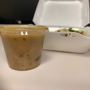 a plastic cup of soup