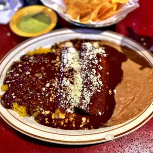 Chicken Mole enchiladas with Mole over rice