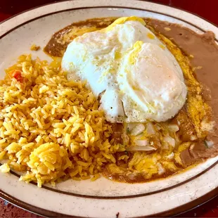 Texas Plate, 2 ground beef enchiladas, 2 eggs, rice and beans. I liked chopped onions on top of the enchiladas. So tasty!!