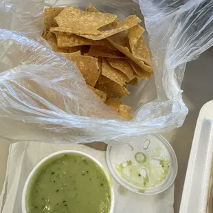 Chips and salsa. I prefer the red sauce over the green.  The green salsa is not spicy and I prefer spicy.