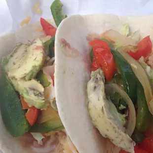 Vegetarian tacos. Grilled vegetables, rice, beans and avocado. They are okay. Nothing special though.