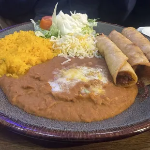 Chicken flautas with rice and beans