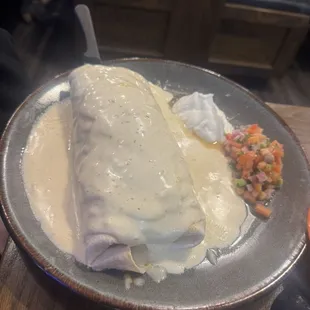 Las Palomas Burtito. Steak and beans covered in queso