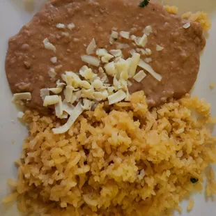 The side of rice and bean that came with the street tacos.