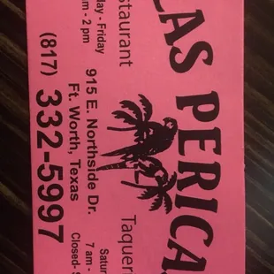 a pink ticket with a palm tree on it