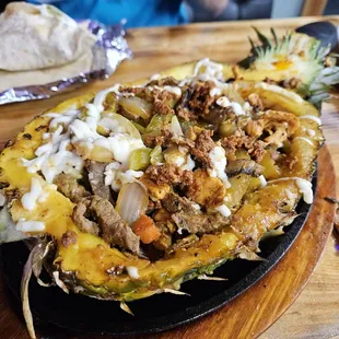 Pineapple fajita. Ater a few scoops in,  was perfectly sweet, liked the addition of veggies beyond peppers and onions.