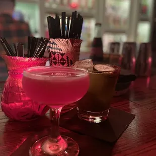 two cocktails on a bar