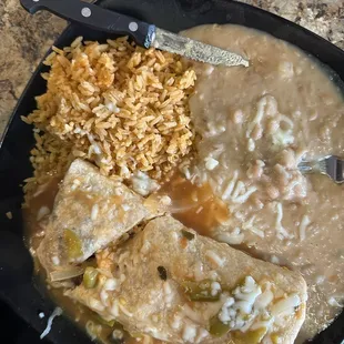 Wet burritos covered in red sauce