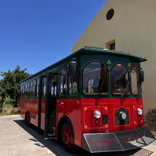 a tour bus parked in front of a building