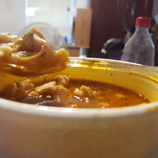 Spoon full.of menudo.