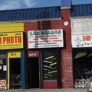 a car parked in front of a business