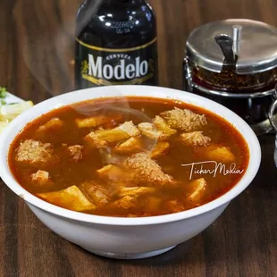 a bowl of soup and ingredients