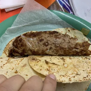 Large bean taco with grilled onions made special