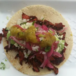 Taco al pastor :) soo good.  You put the topping you want on top.