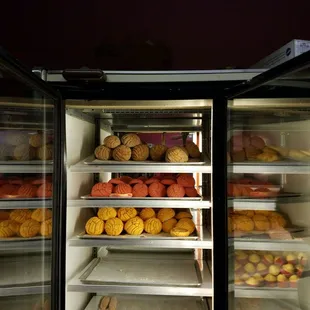 a refrigerator full of baked goods