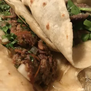Carne guisada on the left and beef fajita
